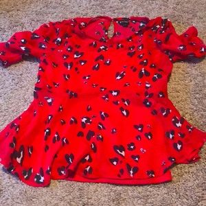 Red blouse with black and white hearts
